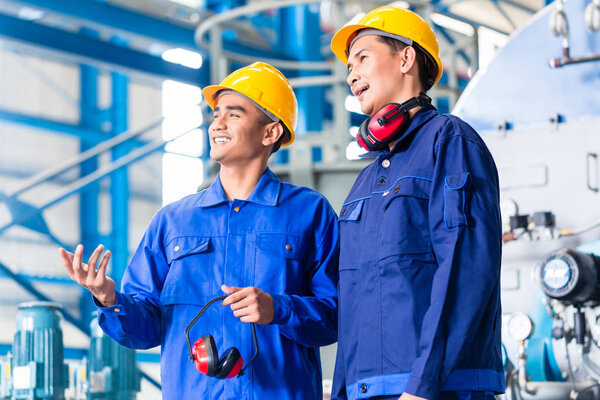 Worker in Asian manufacturing plant