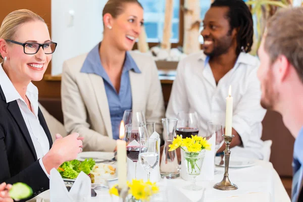 Business lunch in restaurant with food and wine Royalty Free Stock Photos