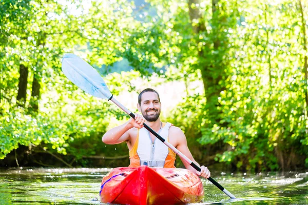 Man paddling with kayak