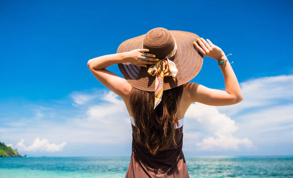 Woman enjoying the view at the beach or ocean