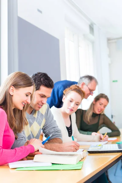 Students with professor in college — Stock Photo, Image