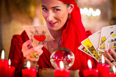 Soothsayer in Seance or session with tarot cards clipart