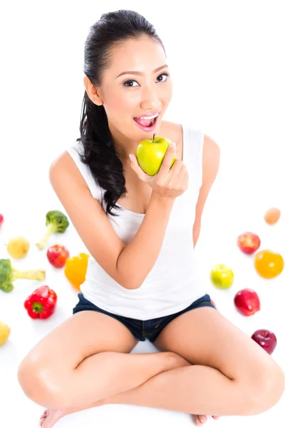 Asian woman eating apple — Stock Photo, Image