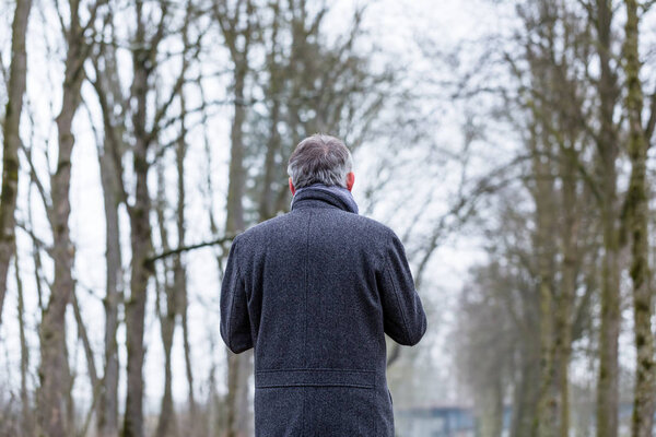 Sad and lonely man walking