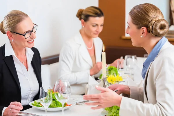 Businesswomen meeting at business dinner