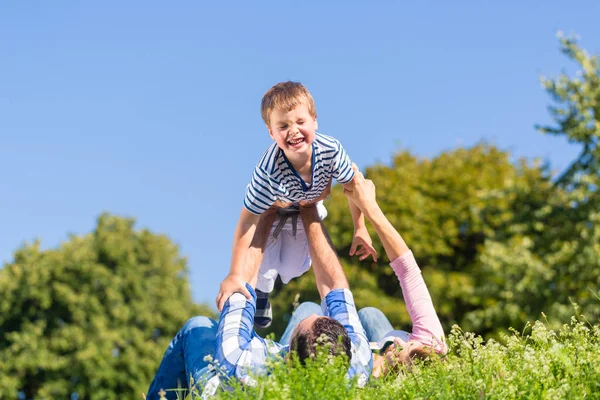 Family playing with son — Stock Photo, Image