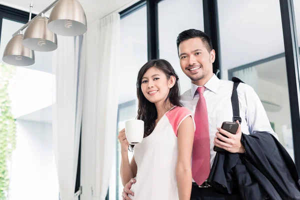 Couple having breakfast before man goes to office — Stock Photo, Image