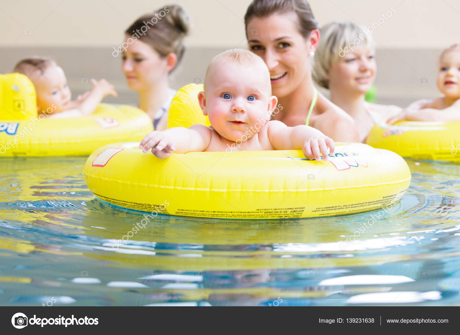 Infant swimming class — Stock Photo © Kzenon 139231638