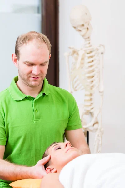 Physiotherapist massaging womans face — Stock Photo, Image
