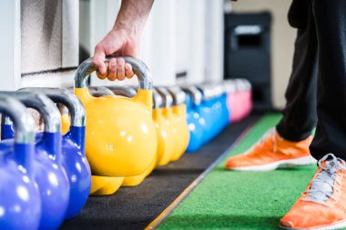 Man lifting kettlebell clipart