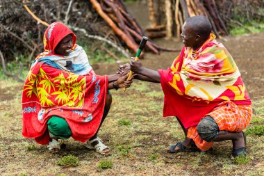 Massai men shaking hands clipart