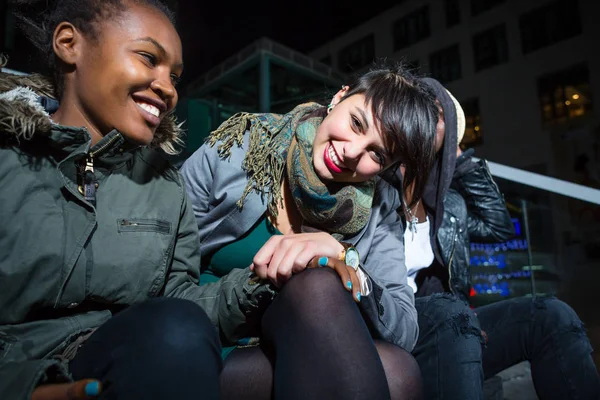 Friends sitting on stairs — Stock Photo, Image