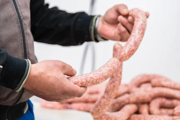 Butcher making sausages — Stock Photo, Image