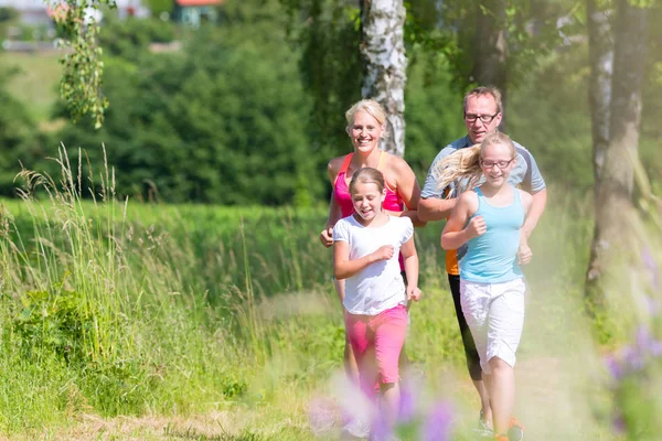 Family running for better fitness in summer — Stock Photo, Image