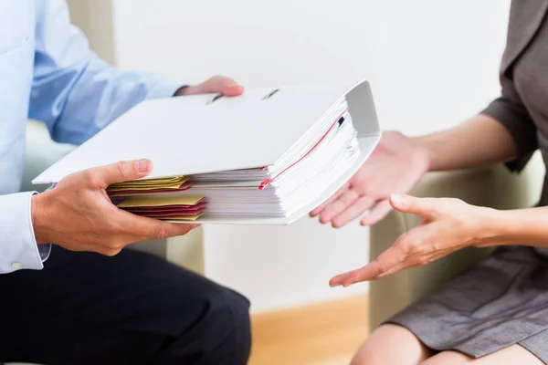 Financial consulting - customer handing over documents