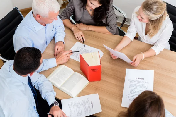 Lawyers in law firm reading documents and agreements — Stock Photo, Image