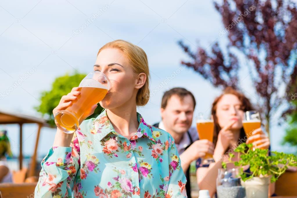 Woman drinking with friends 