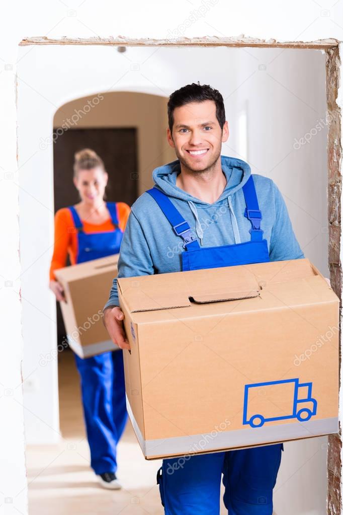 Man and woman moving in new home 