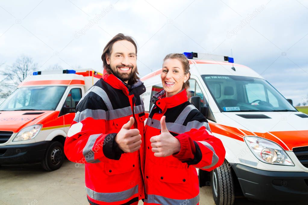 Emergency doctor and paramedic with ambulance  