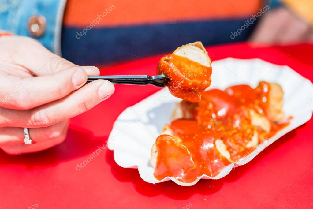 Eating Currywurst in Berlin