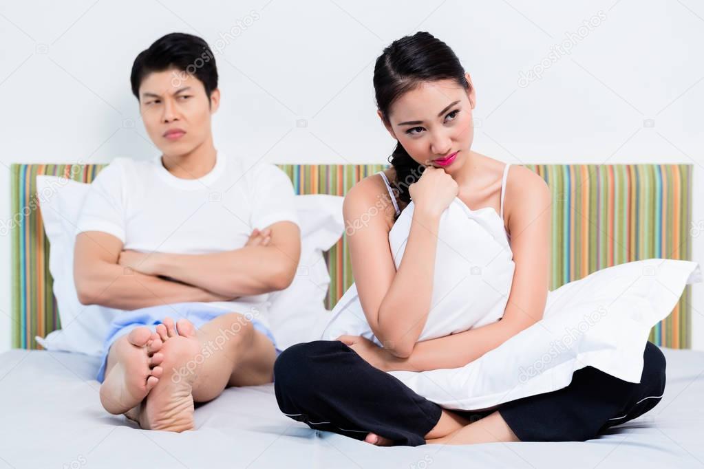 Alienated Chinese couple, woman is rejecting her man