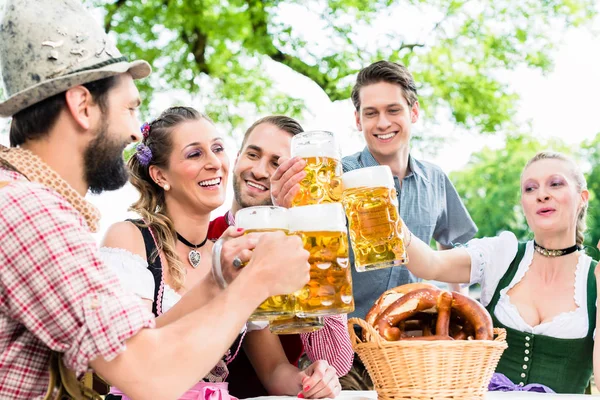 Clinking glasses with beer — Stock Photo, Image