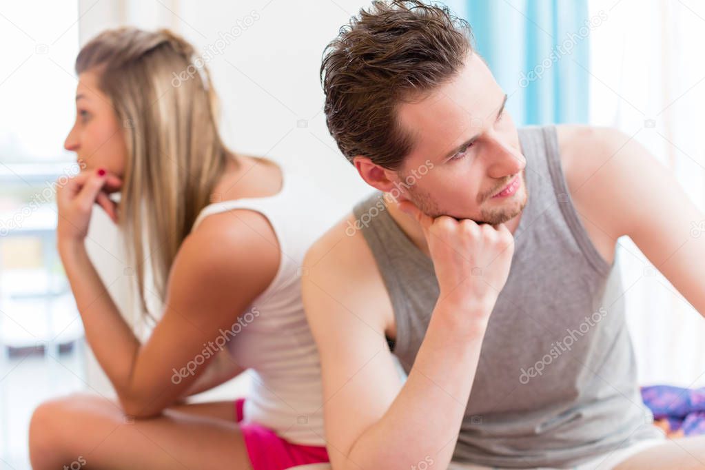 Arguing young couple, man is huffy and remains silent