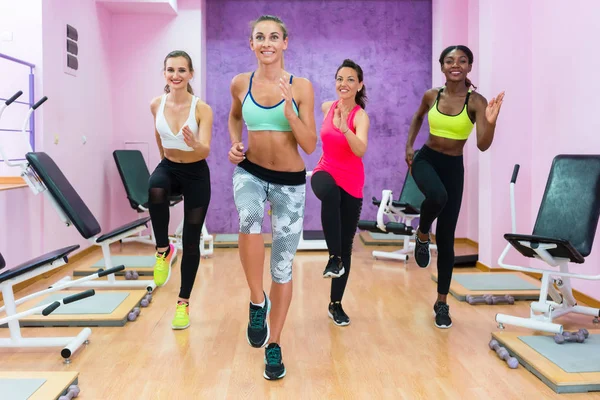 Beautiful women running on spot — Stock Photo, Image