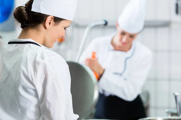 Female chefs at kitchen — Stock Photo, Image