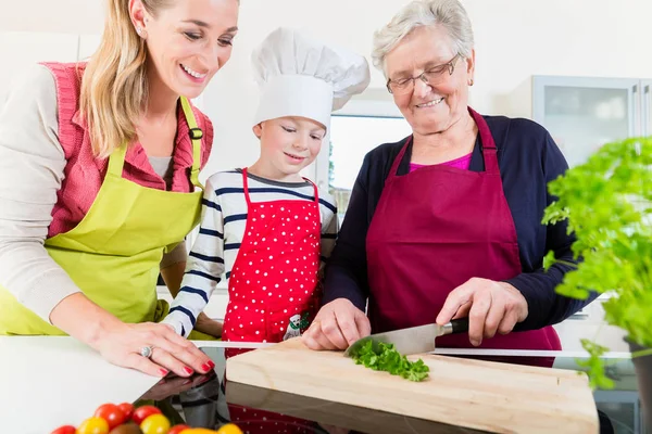 Granny Grandson Daughter Chopping Herbs Wooden Board — Stock Photo, Image