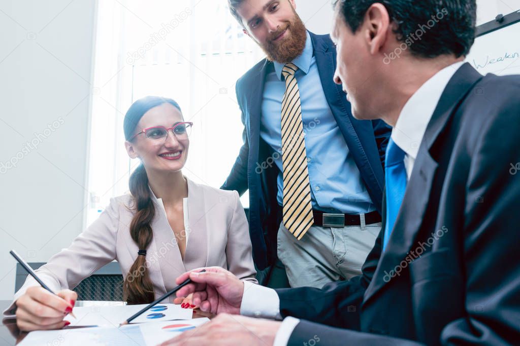 Business team having motivating discussion in office