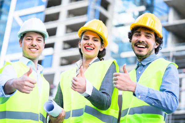 Team of civil engineers and architects at construction — Stock Photo, Image