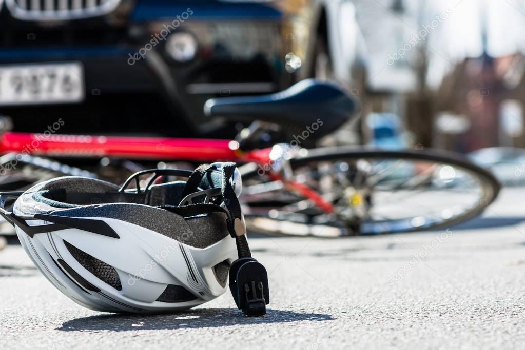 bicycling helmet on asphalt 