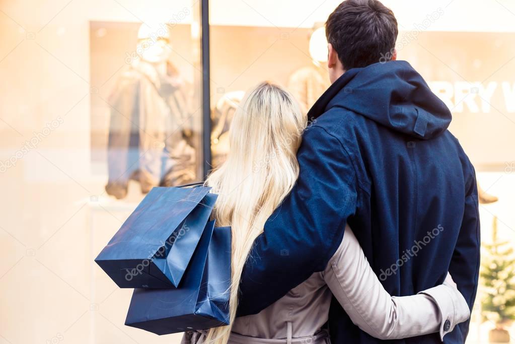 Couple looking at shopping window