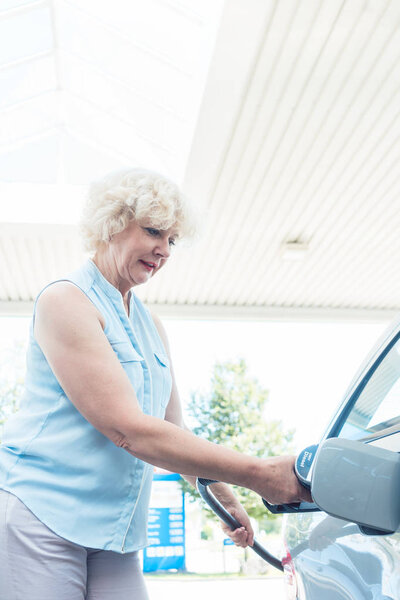 woman filling up gas tank