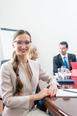 Portrait of a beautiful business woman looking at camera during clipart