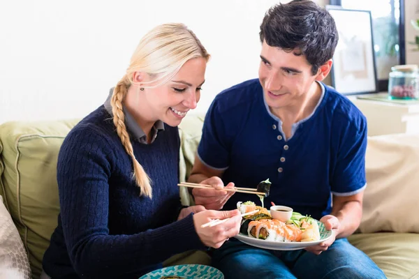 Couple eating Japanese traditional food — Stock Photo, Image