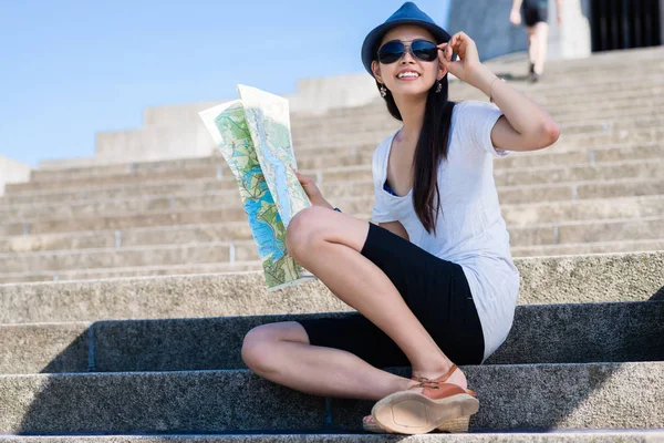 Asian female tourist smiling  outdoors