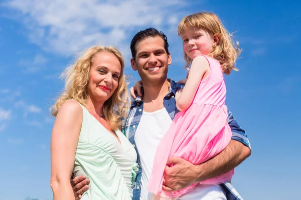 Father, Mother and daughter in embrace — Stock Photo, Image