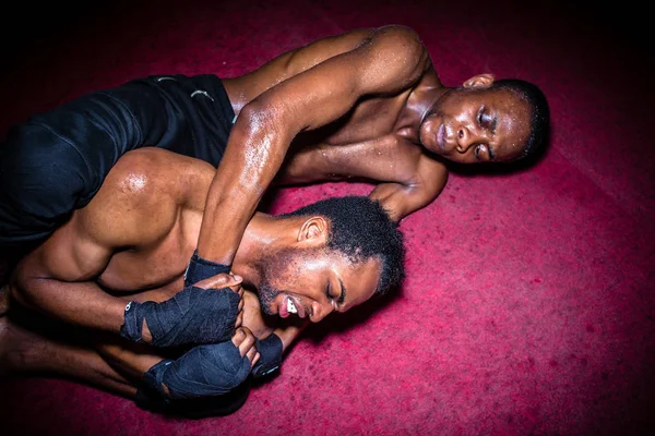 Two African American opponents struggling for dominance in groun — Stock Photo, Image
