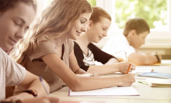 Students writing a test in school class — Stock Photo, Image