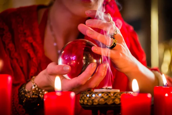 Soothsayer in Seance with Crystal ball and smoke — Stock Photo, Image