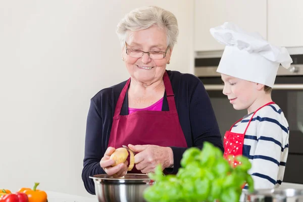 Grandma and grandson cooking together — Stock Photo, Image