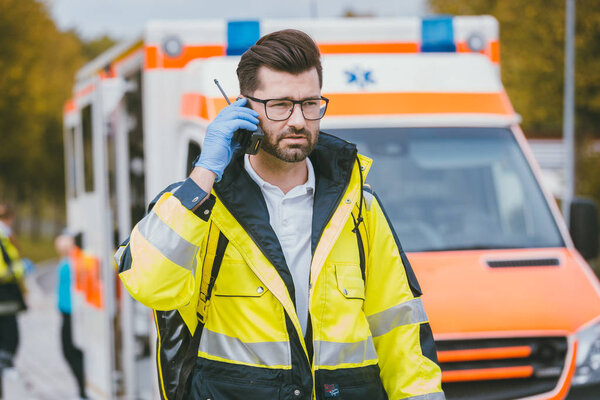 Medic talking to headquarter via radio 