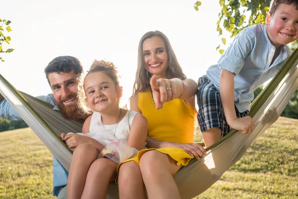 Family Portrait Beautiful Mother Two Playful Children Swinging Hammock While — Stock Photo, Image