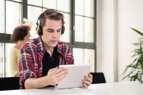Young Man Using Headphones While Watching Video Tablet Work Meeting — Stock Photo, Image