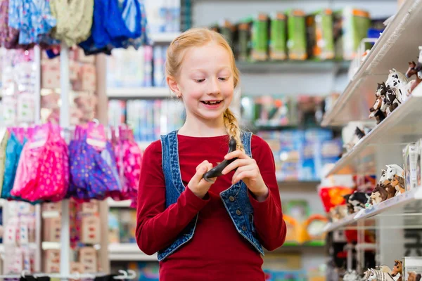 Happy Girl Choosing Toy Figures Store — Stock Photo, Image