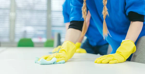 Close-up of cleaning team working in an office — Stock Photo, Image