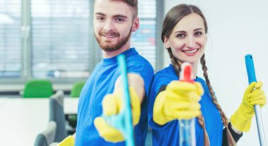 Woman and man in commercial cleaner team clipart