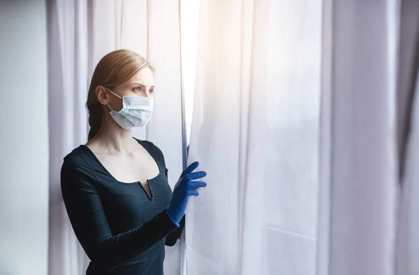 Bored woman in corona quarantine or under curfew — Stock Photo, Image